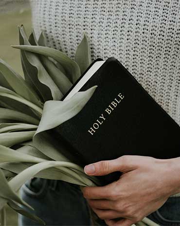 Women Holding Bible